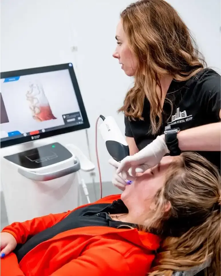 Clinician using a 3D scanner during a patient visit